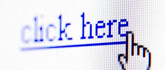 Cursor hovering over hyperlinked text that reads click here.